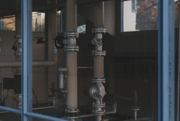 A machined steel flange with a gasket seated in the groove, representing precise documentation and knowledge retrieval in Alberta energy operations