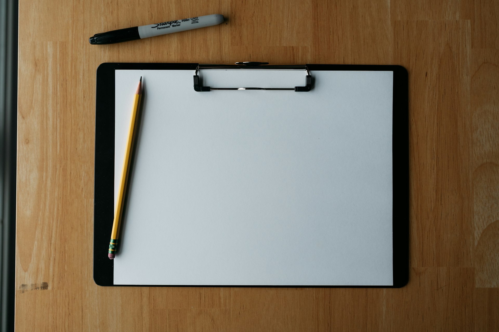 A clipboard with a checklist on a desk, representing a practical AI governance checklist for growing companies