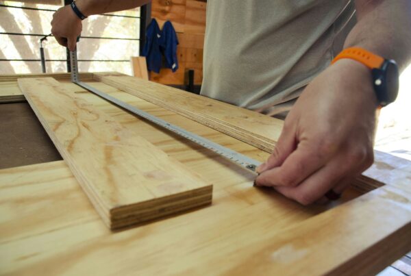 A carpenter spirit level resting on wood, representing checking whether a business is level and ready before building an AI system