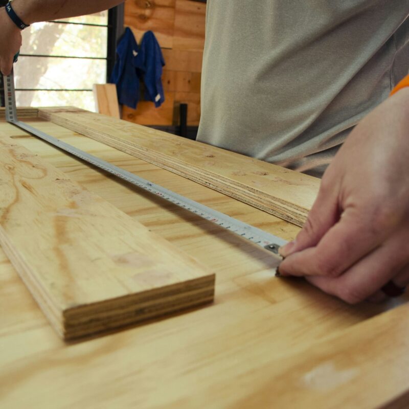 A carpenter spirit level resting on wood, representing checking whether a business is level and ready before building an AI system