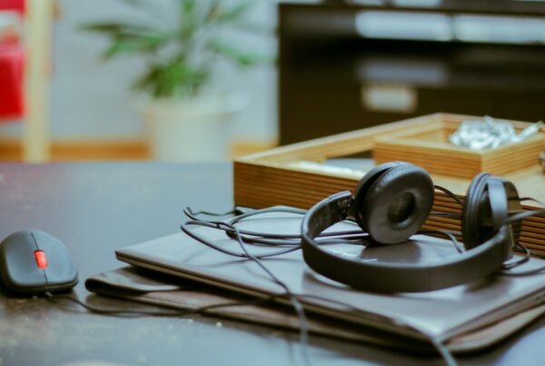 A vintage telephone headset on a desk, representing customer service automation designed to resolve requests instead of deflect them