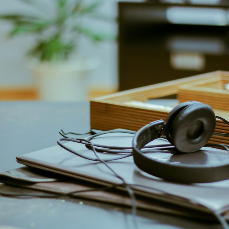 A vintage telephone headset on a desk, representing customer service automation designed to resolve requests instead of deflect them