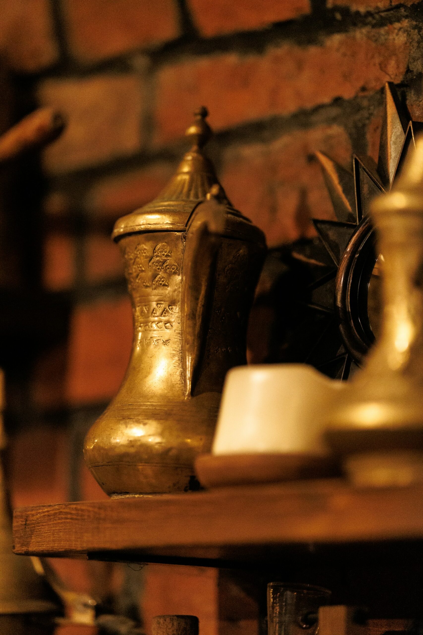 A set of graduated brass weights arranged in a row, representing scoring and ranking AI use cases by value and risk