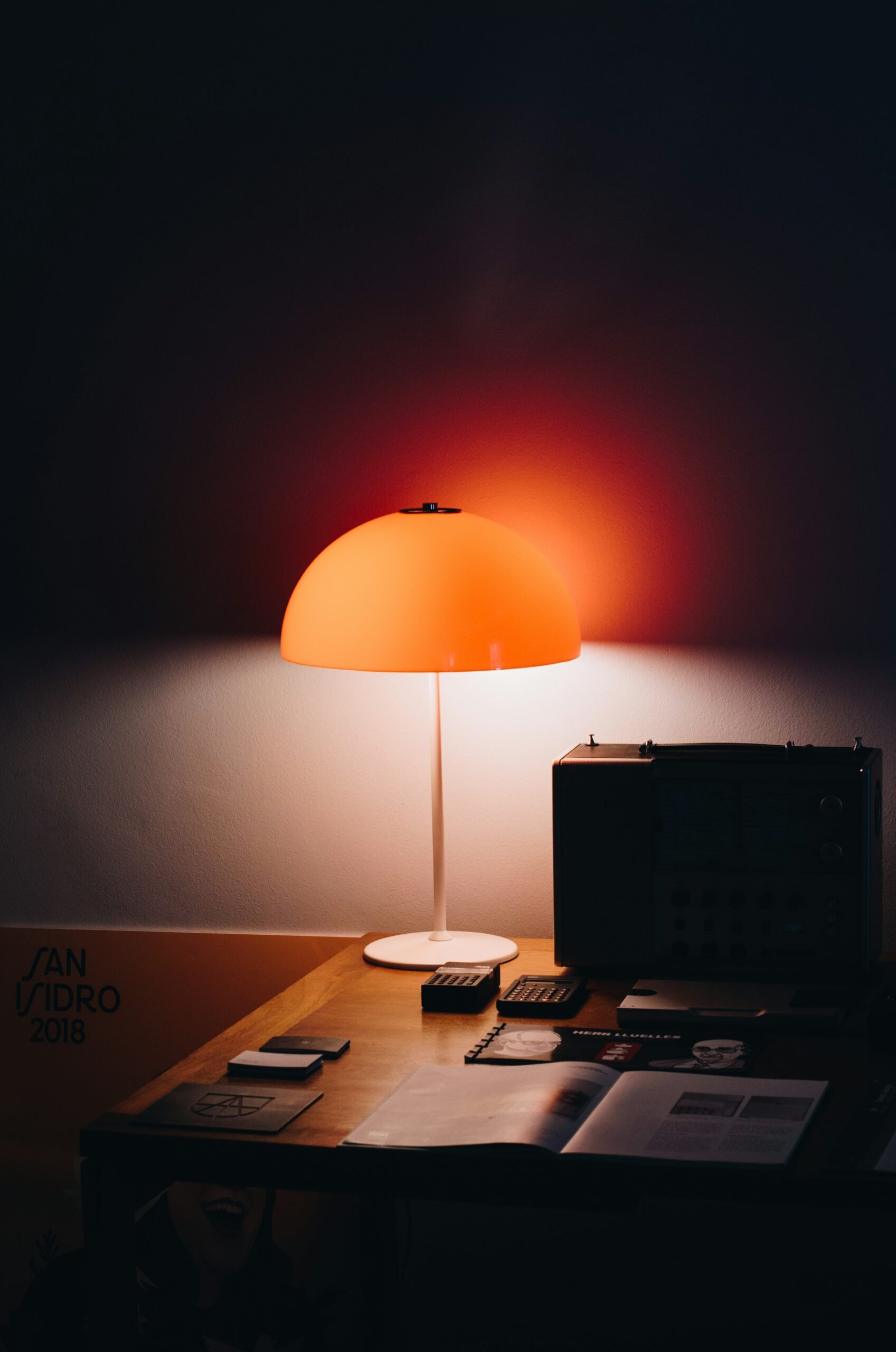 A flashlight beam cutting through a dark office, representing shadow AI use already happening inside a company