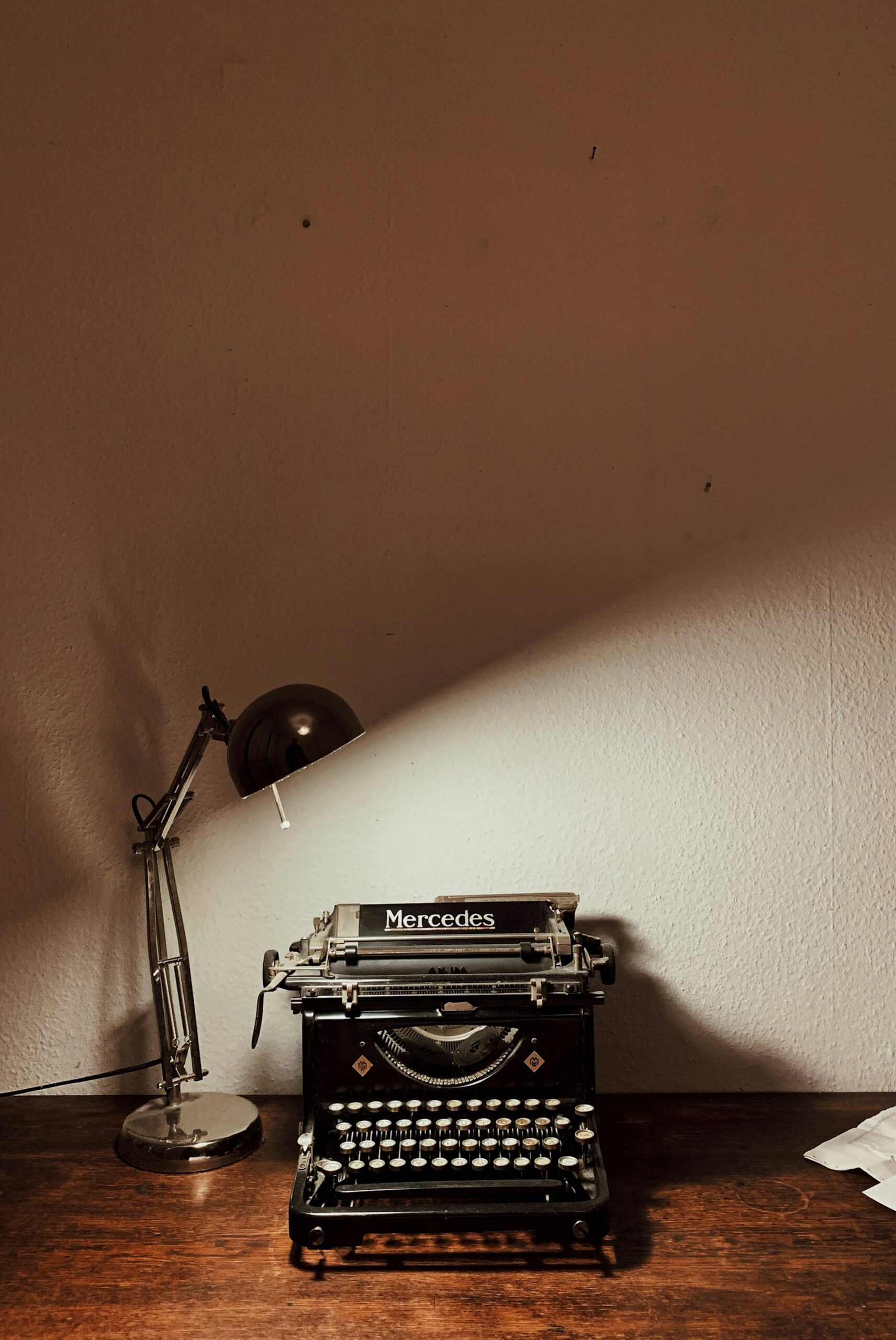A vintage typewriter on a desk, representing the line between AI-assisted production work and human-led brand positioning in marketing