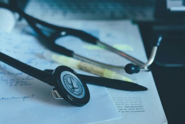 Stethoscope resting on medical paperwork, illustrating AI for health clinics