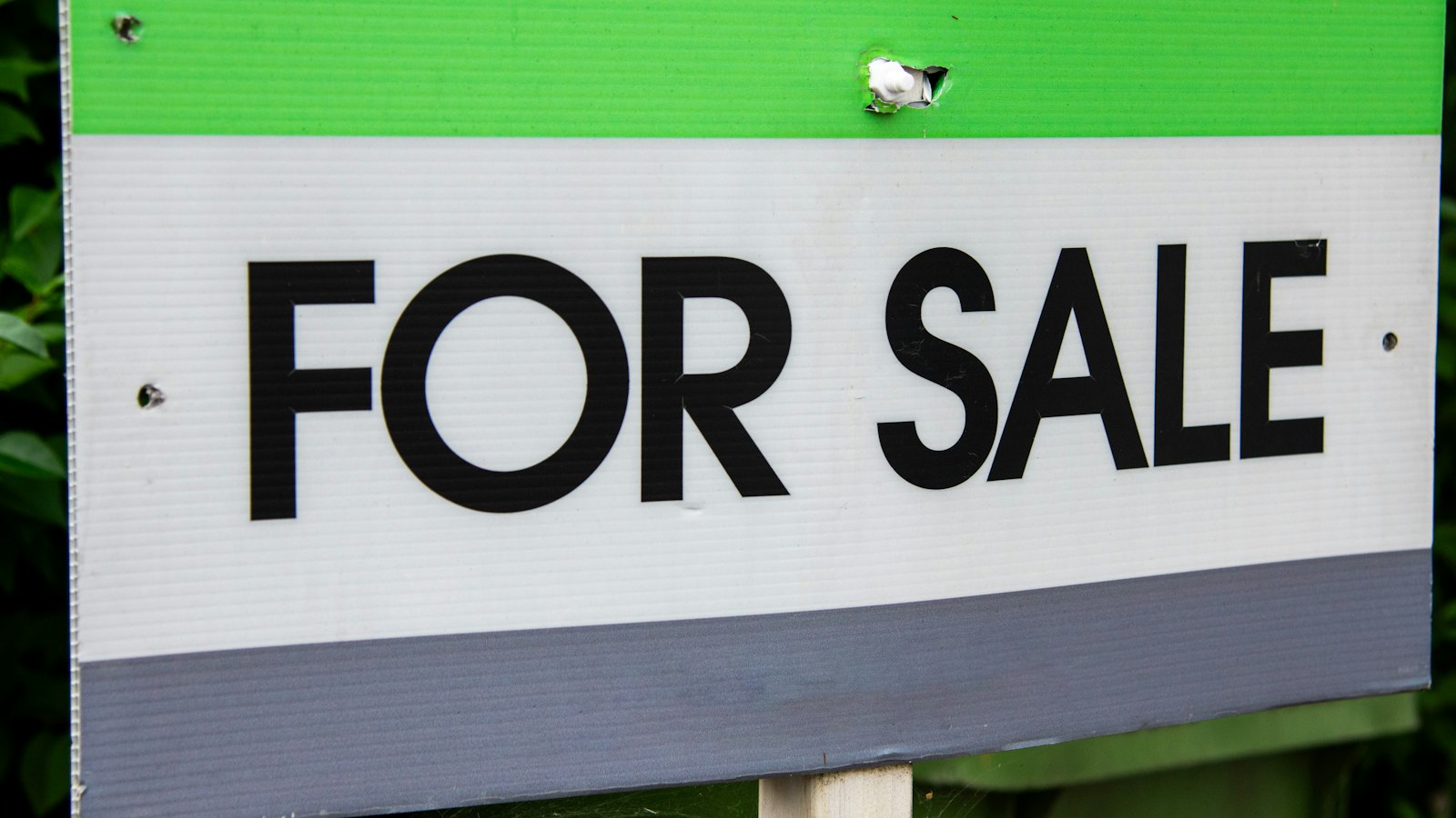 For sale sign in front of a home, illustrating AI for Alberta real estate