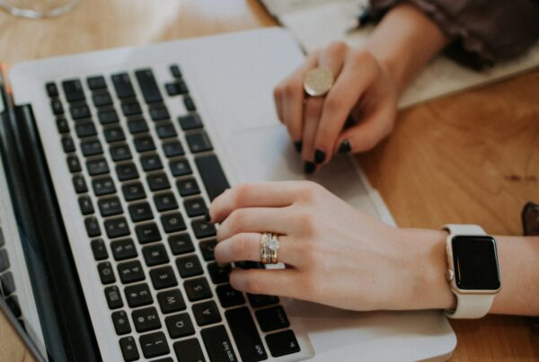 Person typing on a laptop, asking is ChatGPT safe for company data