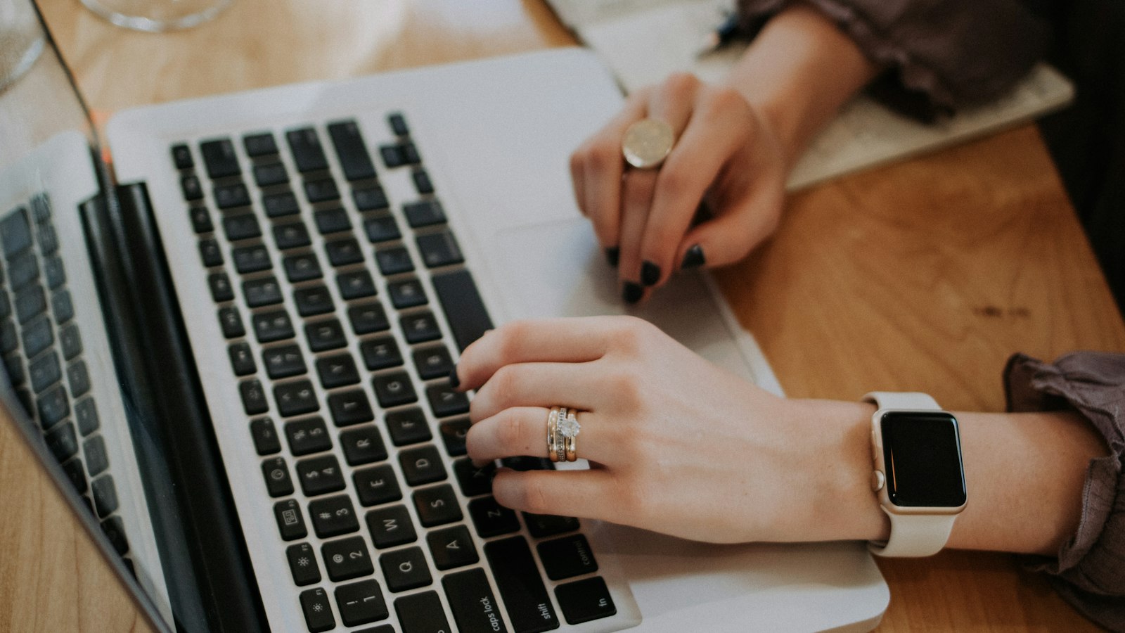 Person typing on a laptop, asking is ChatGPT safe for company data
