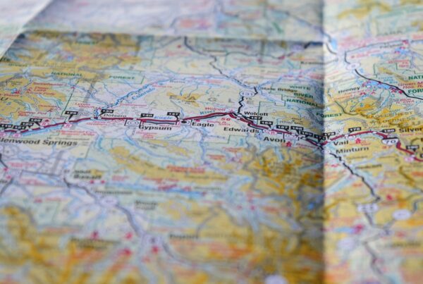 A folded paper map spread out for planning a route