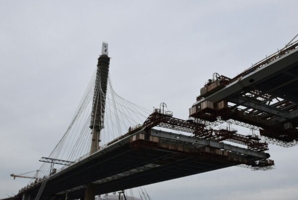 A bridge span under construction that has not yet reached the other side