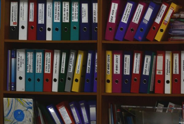 Rows of labelled ring binders on office shelves, illustrating what is RAG