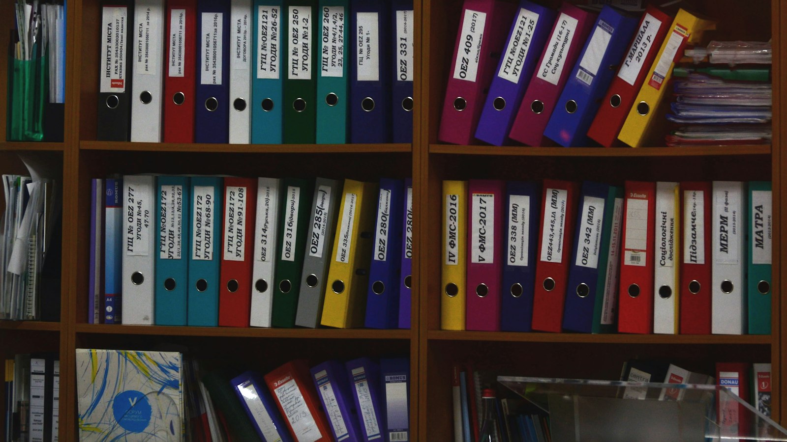 Rows of labelled ring binders on office shelves, illustrating what is RAG