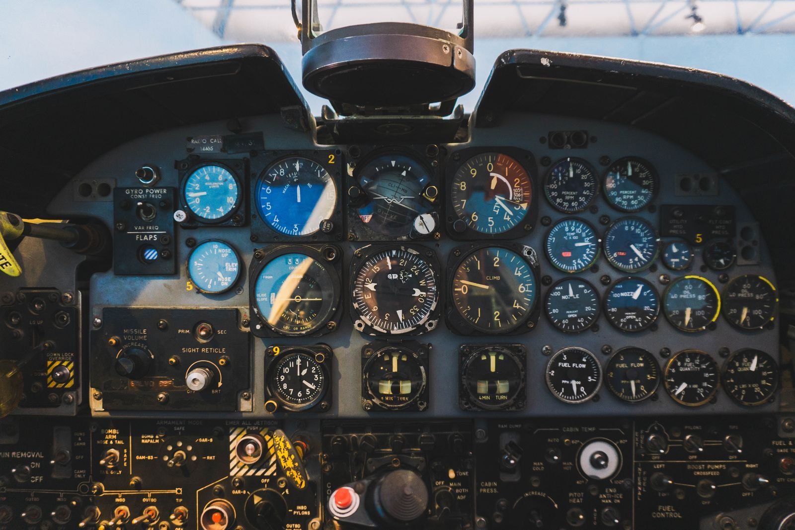 A wall of round aircraft gauges and instruments.