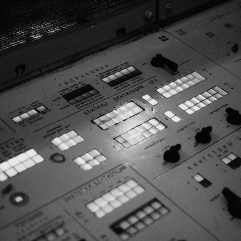 A control panel of switches and rows of indicator lights.
